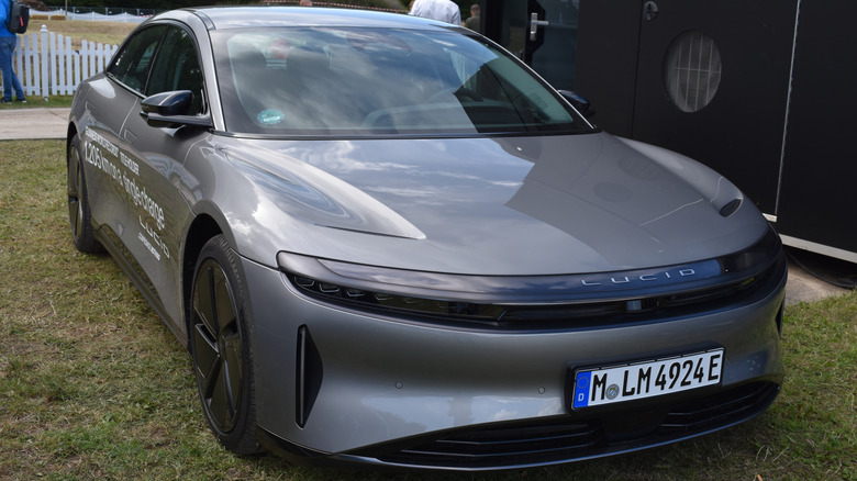 A gray 2025 Lucid Air parked on lawn