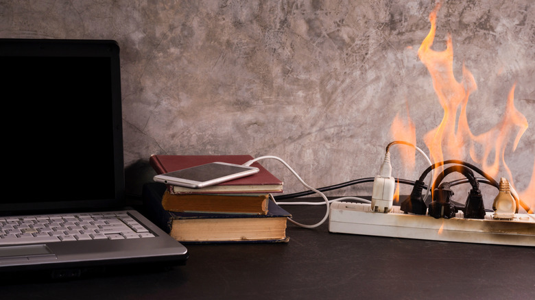 Plugged in devices with socket on fire