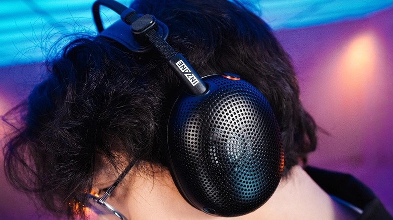 A man wearing the Sony Inzone H6 Air gaming headset.