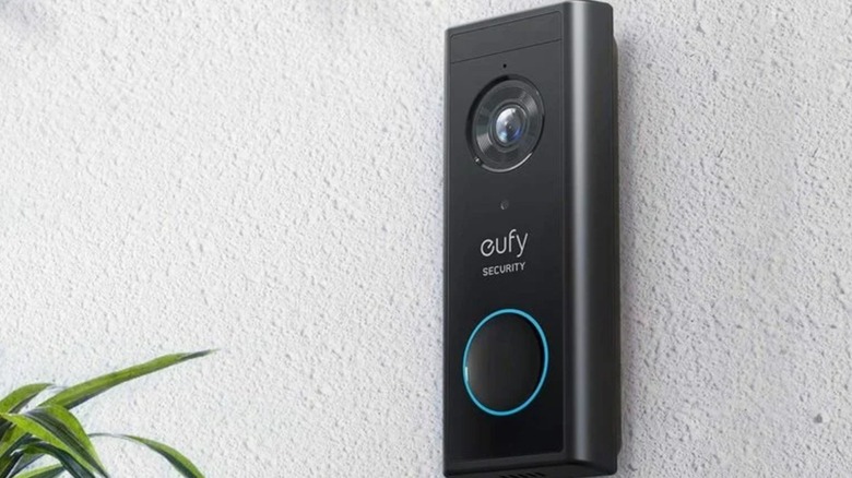 The Eufy S220 video doorbell installed on an outdoor wall.