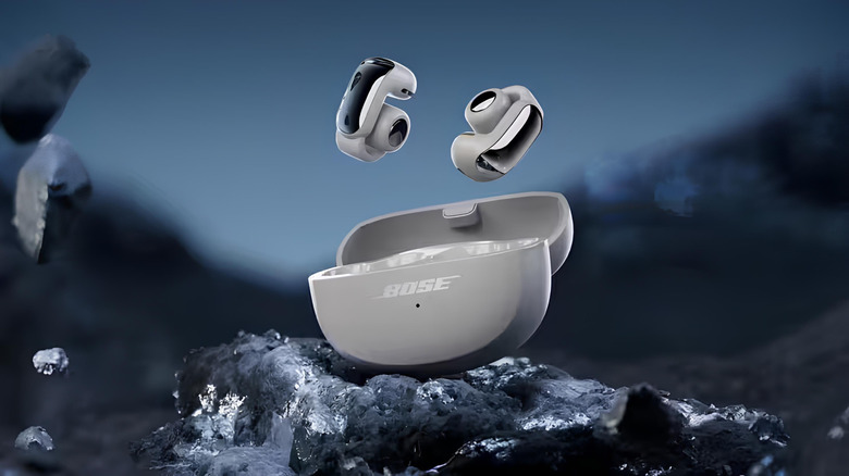 Pair of Bose Ultra open earbuds floating above their case