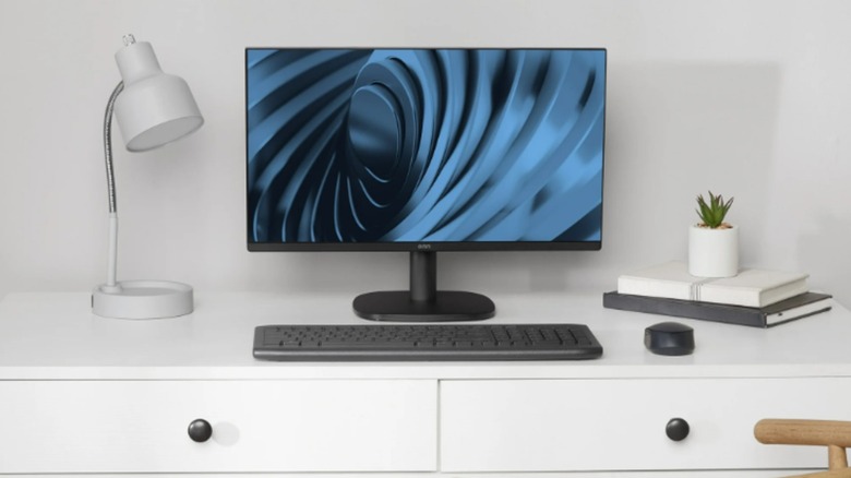 The Onn 22" Office Monitor on a desk along with the keyboard