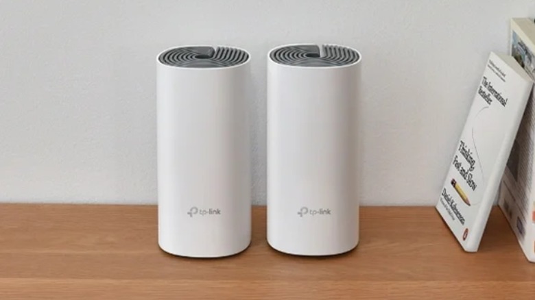 Two TP-Link Deco W2400 mesh units
