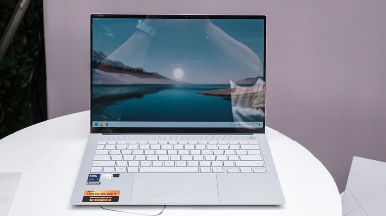 The ASUS Zenbook S 14 placed on a round table