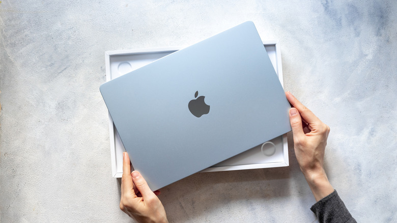 The Apple MacBook Air placed on top of its packaging