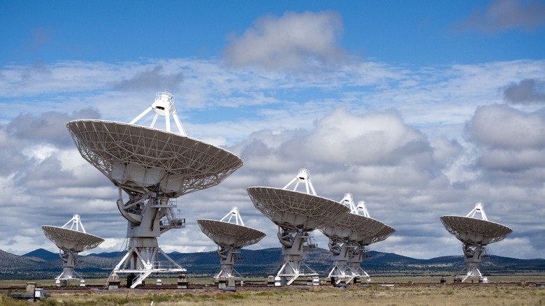 The dishes of the Very Large Array pointed to the sky on a cloudy day