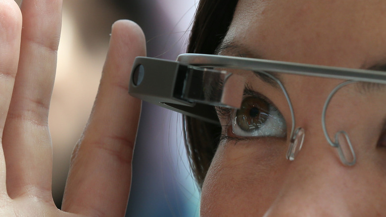 A person wearing Google Glass augmented-reality smart glasses.