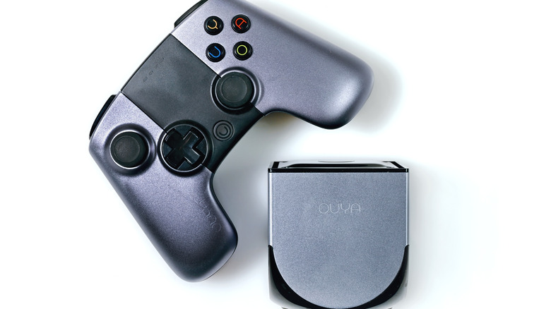 The OUyA microconsole and wireless game controller displayed side by side.