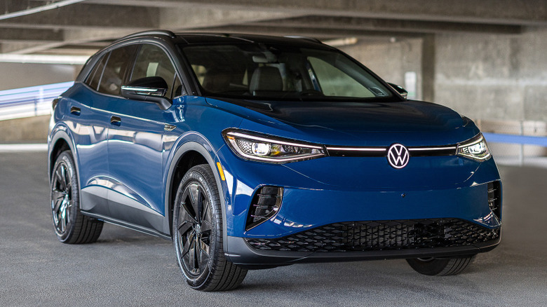 A blue Volkswagen ID.4 parked in a garage