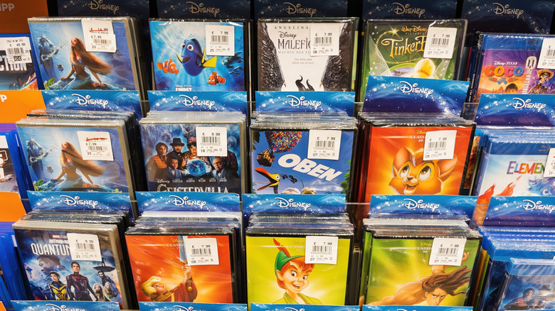 Disney movie DVDs in boxes on a store shelf