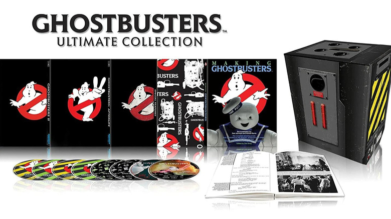 The Ghostbusters Ultimate Collection box set with the Blu-ray discs and collectibles displayed against a white background
