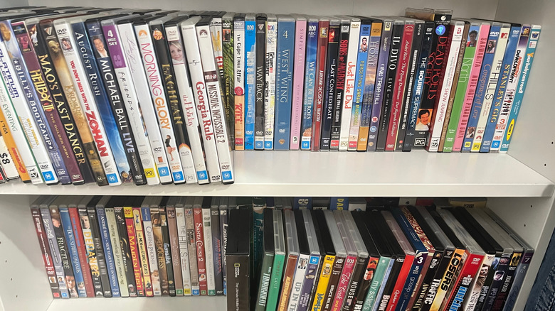 A home DVD collection on a shelf