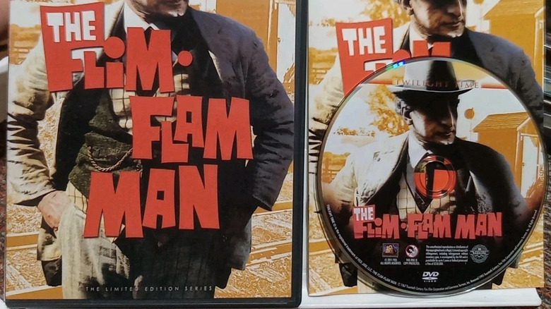 Photo of a Flim-Flam Man DVD alongside the cover