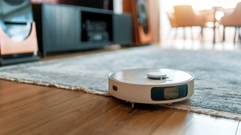 Robot vacuum in a living room with a deep rug