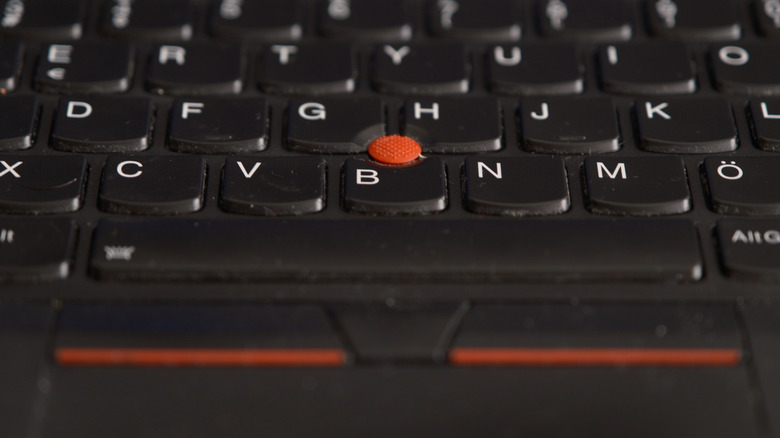 A ThinkPad keyboard with the physical mouse buttons above the trackpad visible.