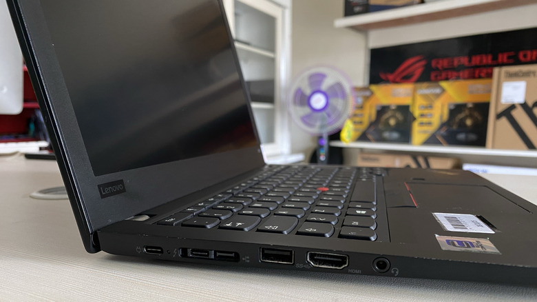 A side view of a ThinkPad with multiple ports visible.