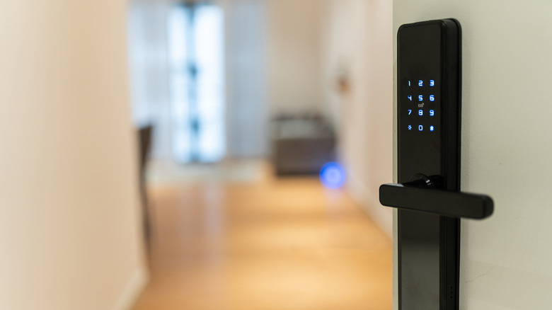 A newly renovated apartment condo with a smart lock on the door