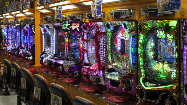 A line of colorful pachinko machines.