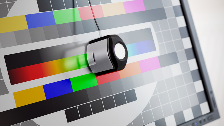 A colorimeter is attached to an LCD for calibration.
