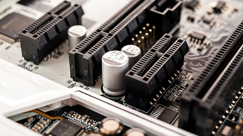 A close-up of a motherboard showing multiple expansion slots.