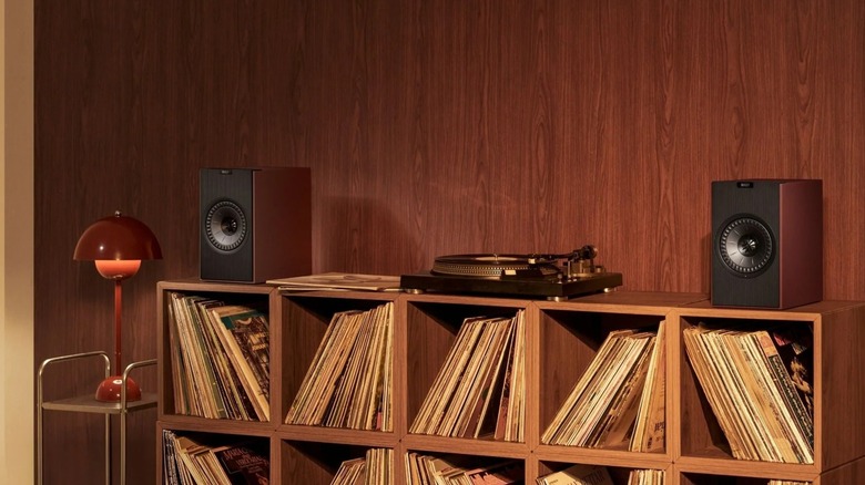 The KEF Coda W speakers on top of a bookshelf.