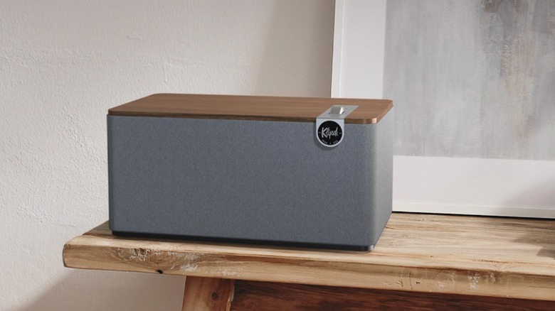 Klipsch The Three Plus Bluetooth speaker on a shelf.
