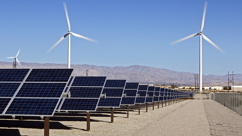 A view of wind turbines and solar panels in the California desert
