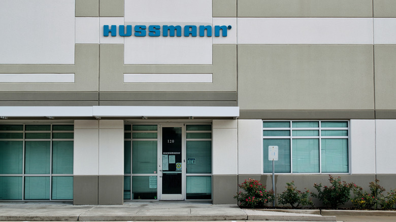 A Hussman Corporation office building with the brand name and logo on the front.