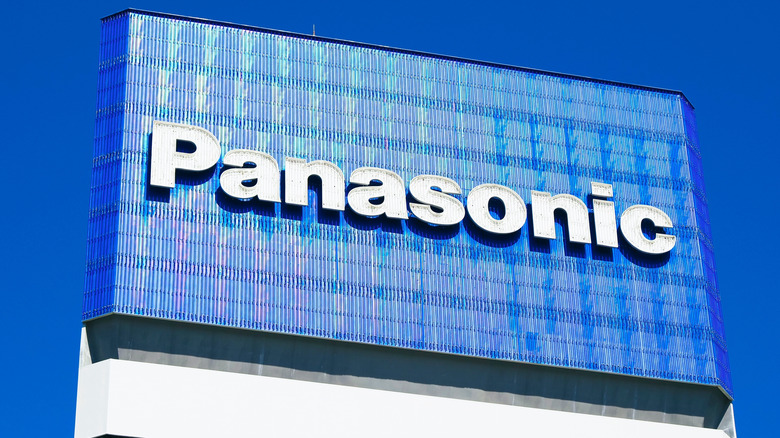 The Panasonic logo on a screen atop an elevated sign.