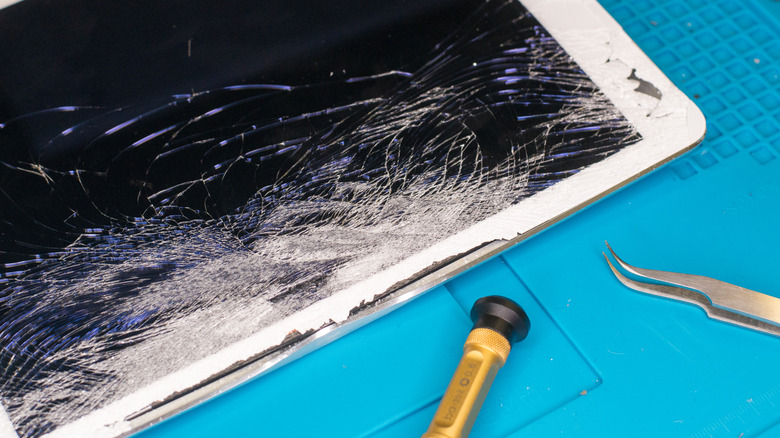 A cracked iPad screen that needs a repair.
