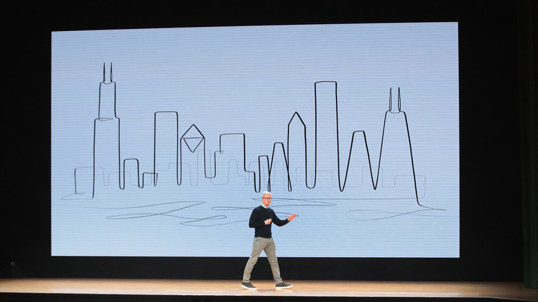 Tim Cook announcing a new iPad on a stage.