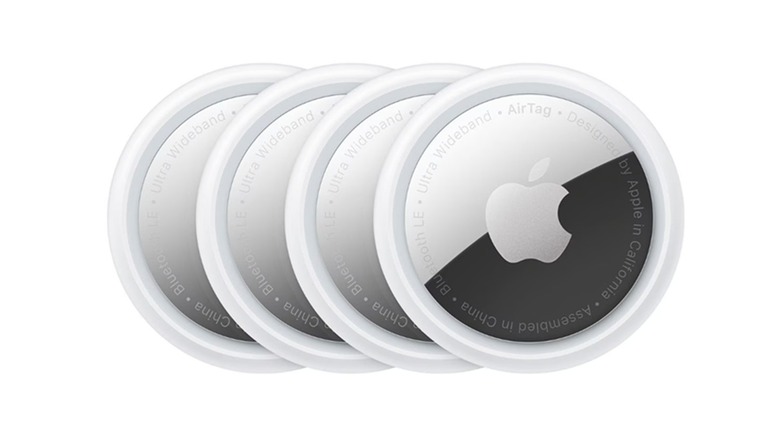Four units of the Apple AirTag (1st Gen), on a white background.