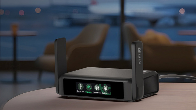 The GL.iNet Slate 7 travel router on a desk in an airport.