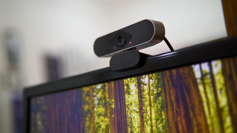 A webcam installed on top of a computer monitor.