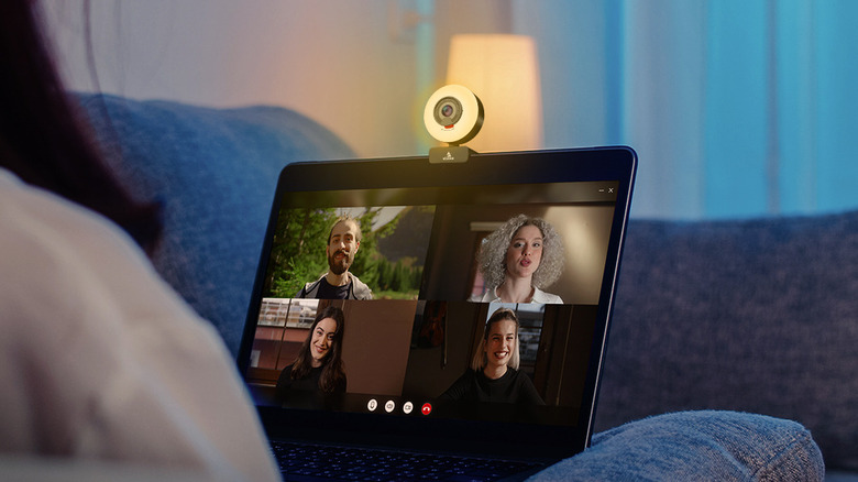 The NexiGo N960E webcam and light installed on a laptop during a video call.