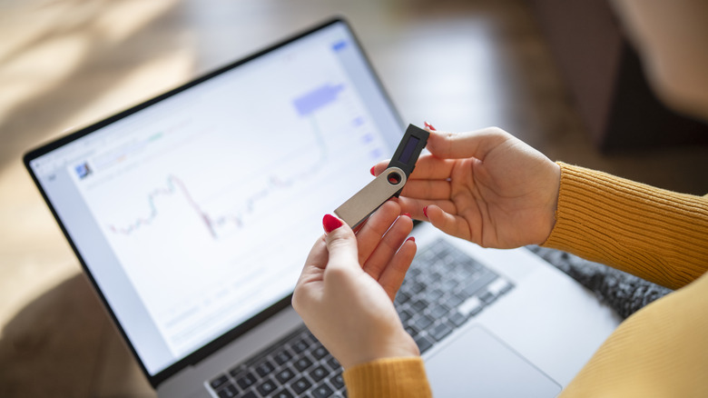 Woman holding a usb flash drive