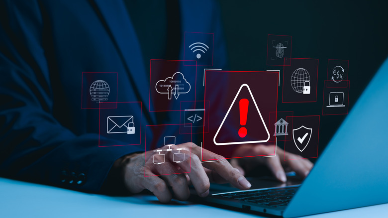 laptop with cybersecurity warnings