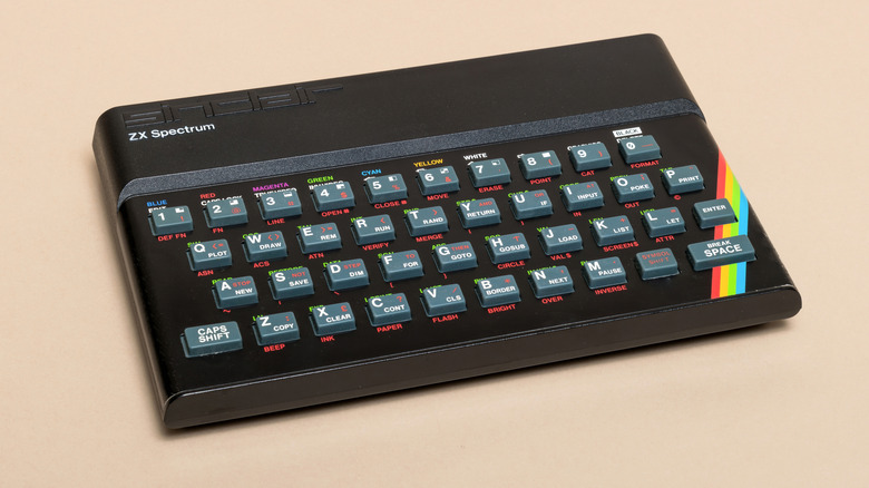 Vintage Sinclair ZX Spectrum home computer with rubber keys and rainbow stripe detail on the right side.