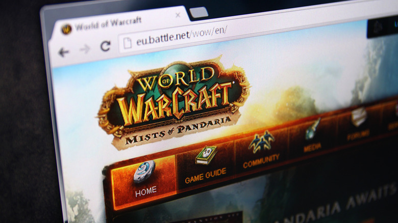 Close-up of a computer screen displaying the World of Warcraft: Mists of Pandaria website in a web browser.