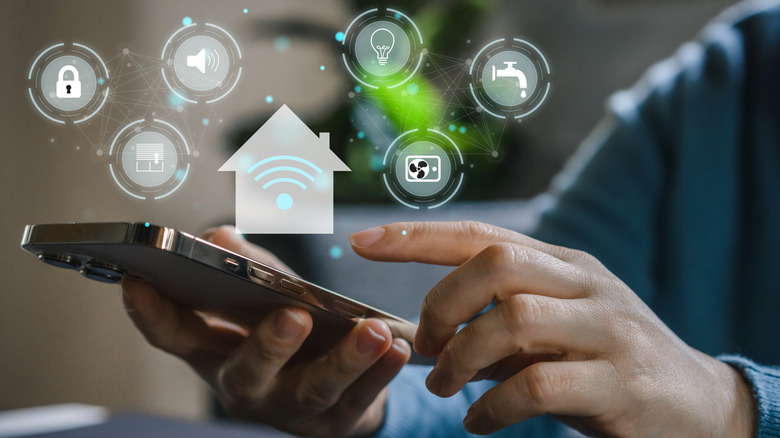 A person managing many smart home devices from a smartphone
