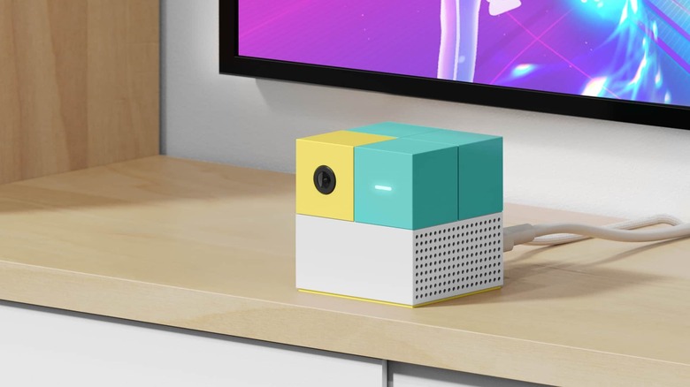 Nex Playground console plugged in below a TV