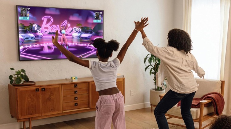 Family using the Nex Playground console in the living room together