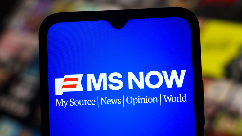 The MS NOW logo on a smartphone screen.