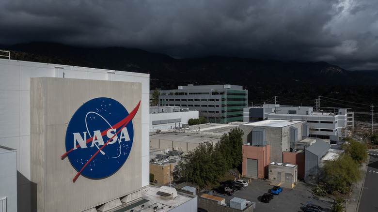 the NASA Jet Propulsion Lab under a stormy sky
