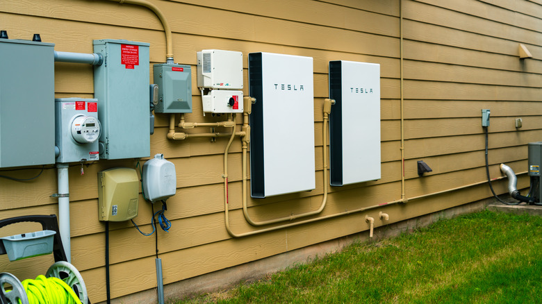 Tesla Powerwall backup batteries installed on the outside of a home.