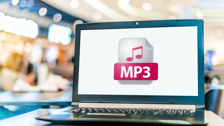 A laptop screen showing an MP3 icon.
