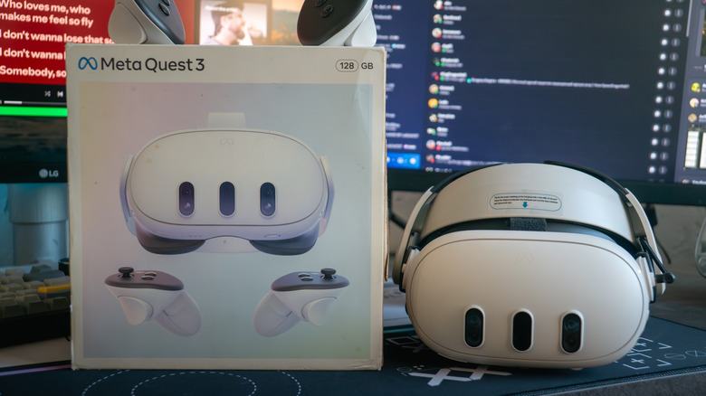 Close-Up of Meta quest 3 headset and box with Discord visible in back