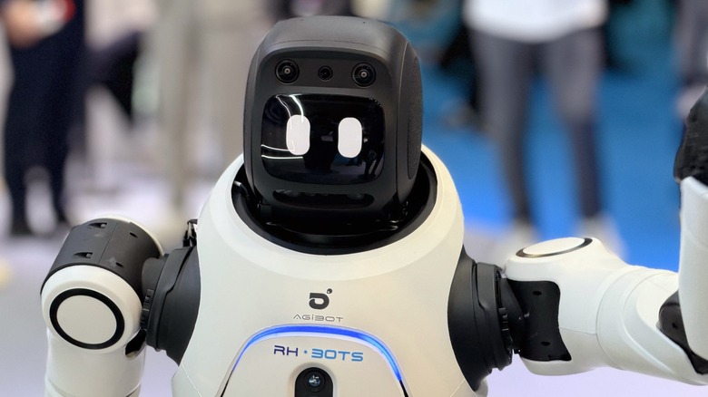 Humanoid robot standing in a booth at MWC 2026