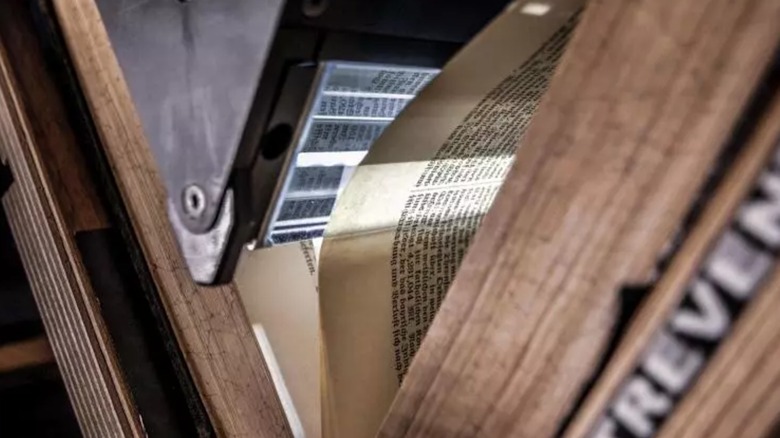Treventus ScanRobot automatic book scanner scanning a book without destroying it