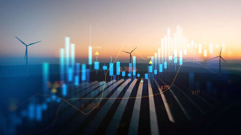 concept of rising energy prices with graph overlaid over wind turbines in the background